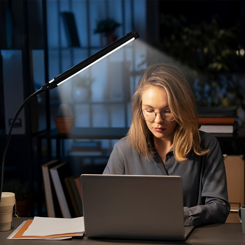 A Clip-On LED Desk Lamp Suitable for Home Office Use, Offering Three Lighting Modes And Ten Brightness Settings, with a Long Flexible Gooseneck And Swing Arm for Focused Lighting, Powered by USB, in Black Color