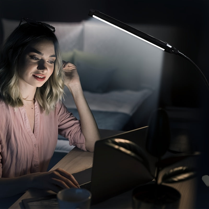 A Clip-On LED Desk Lamp Suitable for Home Office Use, Offering Three Lighting Modes And Ten Brightness Settings, with a Long Flexible Gooseneck And Swing Arm for Focused Lighting, Powered by USB, in Black Color